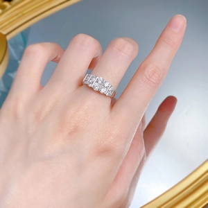 Macro shot of silver S925 ring featuring five sparkling round-cut cubic zirconia stones