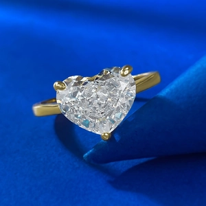 Golden S925 silver ring featuring a 10x8mm heart-cut carbon diamond on a blue background