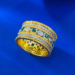 Close-up of S925 engraved gold-plated ring with square emerald and white zircon accents
