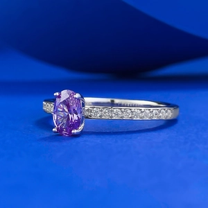 Elegant S925 silver ring featuring an oval purple carbon diamond and white side stones