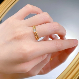 Detailed view of a gold plated Cuban link ring featuring a central round zircon stone