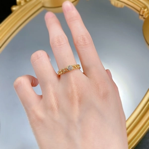 Detail of a 925 silver gold-plated hollow chain ring with a brilliant round solitaire stone