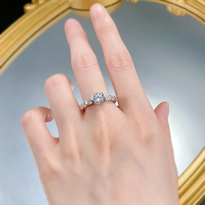Macro shot of S925 silver ring featuring a 7mm round diamond and side stone accents