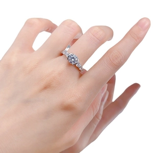 Elegant S925 silver engagement ring with a 7mm round cut diamond and pave side stones