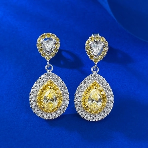 Luxurious S925 silver earrings with pear-cut yellow stones and micro-pave crystals