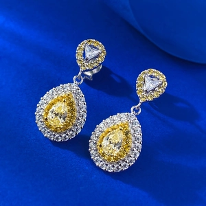 Luxury S925 silver pear-cut yellow zircon earrings with white stones on navy blue velvet