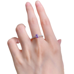 Elegant women's S925 silver ring featuring an oval purple gemstone and side diamonds