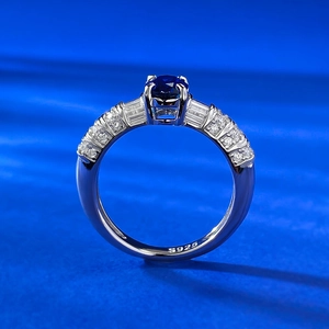 Close-up of S925 sterling silver ring with royal blue oval gemstone and side diamonds