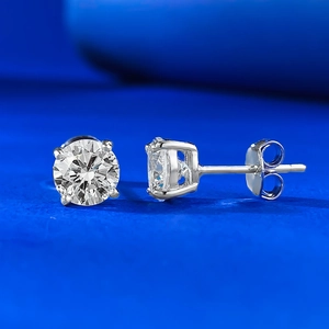 Macro detail of S925 sterling silver studs with round cut stones in a four-prong setting