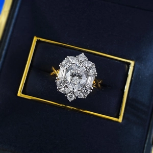 Macro shot of a luxury 925 silver oval-cut halo ring in a premium velvet jewelry box