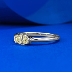 Elegant S925 silver ring featuring a horizontal oval yellow gemstone with a polished finish