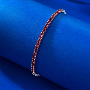 Elegant S925 silver tennis bracelet with single row red cubic zirconia in claw setting