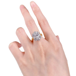 Luxurious 925 silver ring with large oval-cut gemstone and floral halo setting