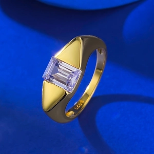 Minimalist S925 gold-plated ring with a rectangular purple gemstone on blue background