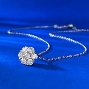 Sparkling S925 sterling silver flower necklace with Moissanite stones on a blue background