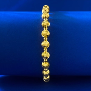 Detailed macro view of S925 sterling silver beads with laser brushed texture on blue velvet