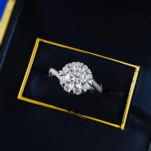 Macro shot of 925 silver moissanite ring with halo setting in a blue velvet box
