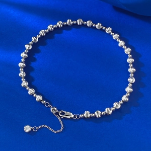 Close-up of S925 silver beaded bracelet with spiral textures and crystal pendant