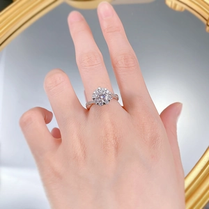 Close-up of S925 sterling silver moissanite ring with twisted band on a hand