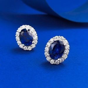 Classic S925 silver stud earrings with oval blue sapphire halo and white crystal accents