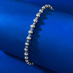 Detail of S925 silver bracelet featuring laser brushed beads and polished mirror finish