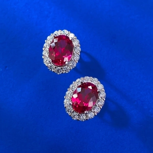 Elegant S925 silver stud earrings with oval pigeon blood ruby and zircon halo design