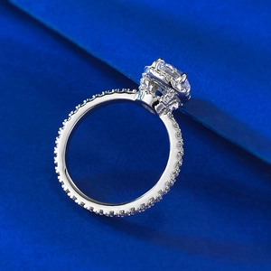 Luxurious S925 silver ring featuring a 1-carat halo-set simulated diamond and pavé band