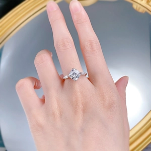 Macro view of S925 silver ring with emerald cut square diamond on a model hand