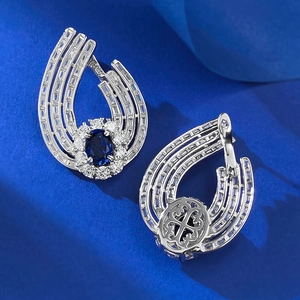 Macro view of S925 silver earrings featuring blue corundum and rectangle cut stones
