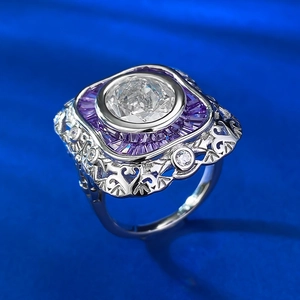 Macro shot of S925 silver ring featuring oval clear zircon and purple baguette stones
