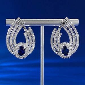 Luxurious S925 silver earrings with oval blue sapphire gems and sparkling diamond accents
