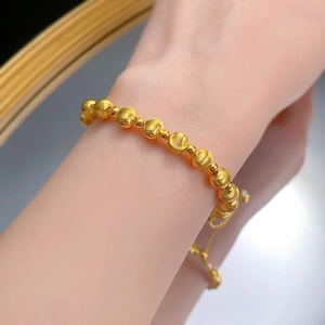 Elegant S925 sterling silver beaded bracelet with brushed gold finish on female wrist