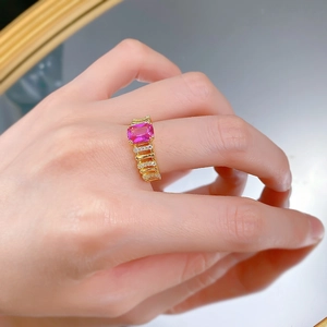 Close-up of a gold-plated S925 silver ring featuring a rectangular pink gemstone and zircons
