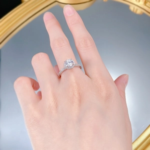 Detailed view of luxury S925 silver ring featuring halo-set simulated diamond on finger