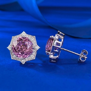 Macro detail of S925 silver flower stud earring with rose purple millennium cut gemstone