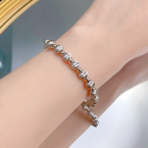 Close-up of S925 sterling silver beaded bracelet with brushed and polished textures