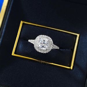 Detailed top view of cushion cut double halo silver ring in a velvet jewelry box