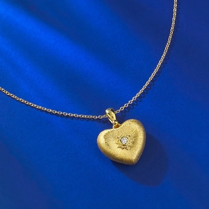 S925 sterling silver heart necklace with gold finish, brushed texture and star setting
