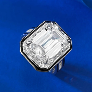 Macro detail of emerald cut 10x14 high carbon diamond ring with baguette side stones