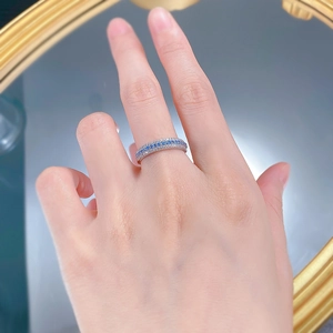 Close-up of S925 silver ring featuring three rows of blue and white pavé-set stones