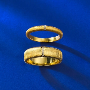 Detailed macro view of S925 sterling silver brushed gold rings with zircon accents