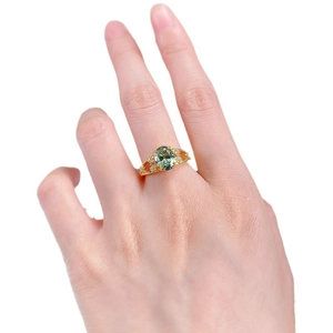 Elegant gold S925 silver ring with oval mint green tourmaline and hollow diamond band