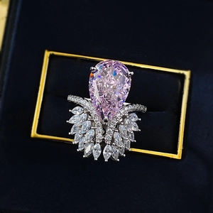 Luxurious S925 silver ring featuring a large pink pear-cut stone in a blue jewelry box