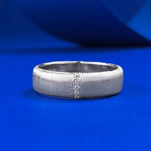 Vertical brushed S925 sterling silver ring featuring a central row of sparkling pavé diamonds