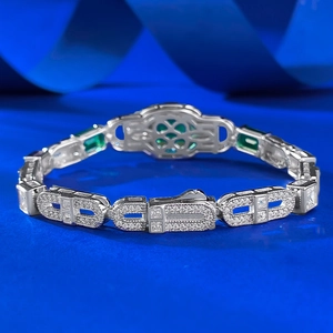 Detailed macro view of S925 silver bracelet featuring emerald-cut green stone and zircon