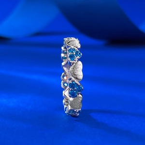 Vintage brushed silver ring with blue heart diamonds and silver hearts in a circle