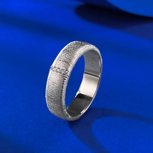 Close-up of S925 sterling silver brushed ring with three white zircon stones and hallmark