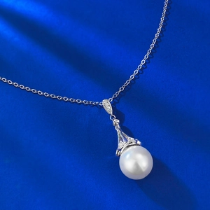 Elegant S925 silver necklace featuring a 12mm white shell pearl and dreamcatcher pendant