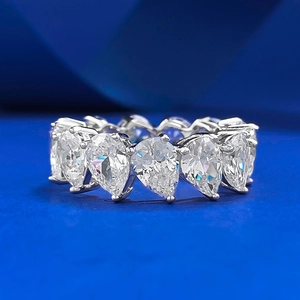 Sparkling S925 sterling silver ring with pear-cut multi-stone clusters on navy blue background