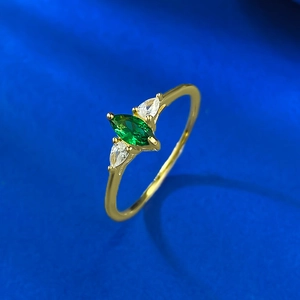 Marquise cut emerald green ring in vintage S925 silver setting with a 45-degree side view